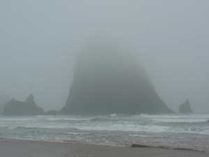 ...the looming dark features of Haystack Rock are revealed.