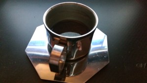 One coffee, one moment - but the picture is not the beverage.